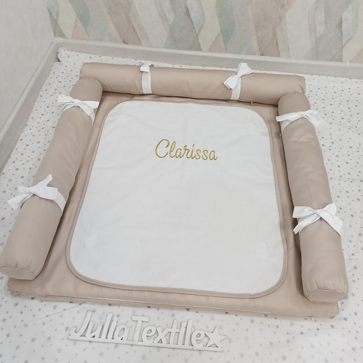 Changing table with white dove gray towel