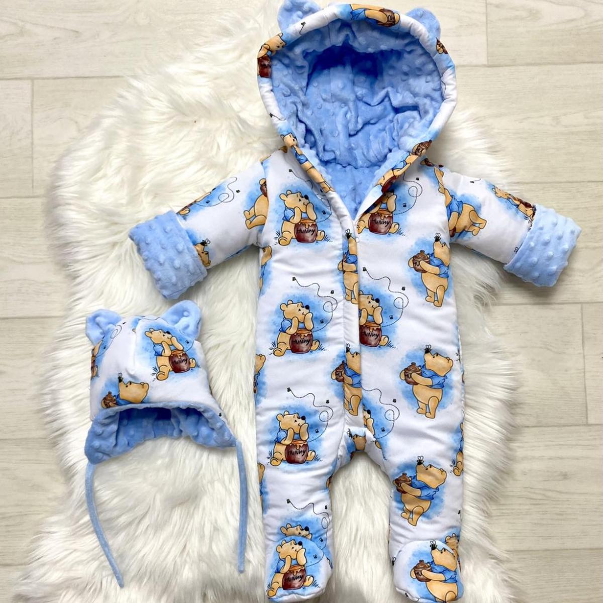Winter onesie with the Winnie the Pooh print in white and light blue