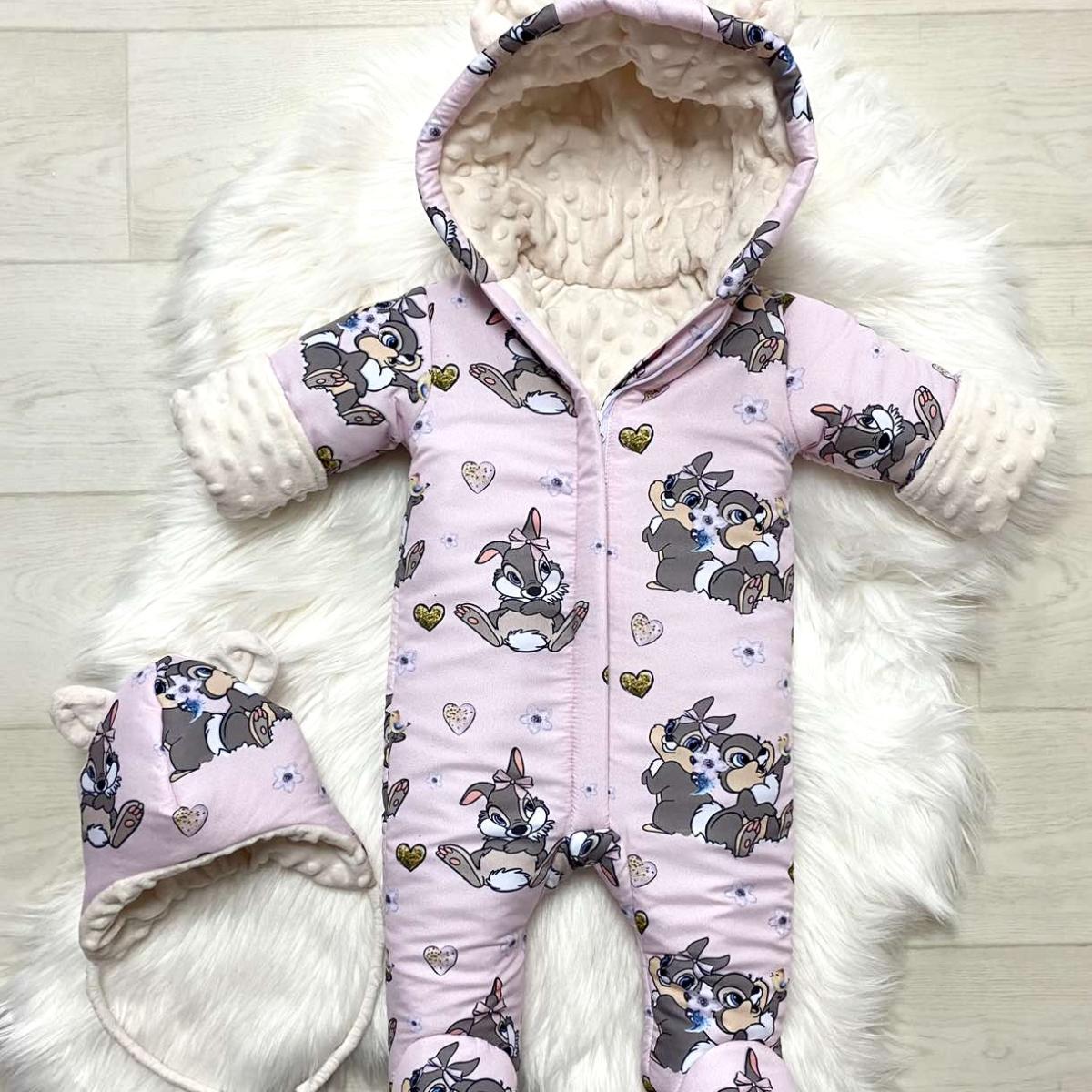 Winter onesie with bunny print on a pink background