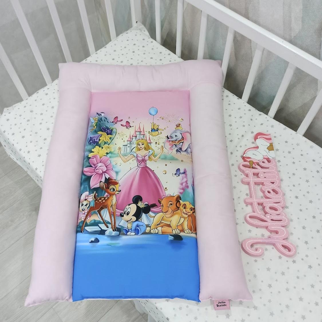 Changing mat with Disney characters pink colored print