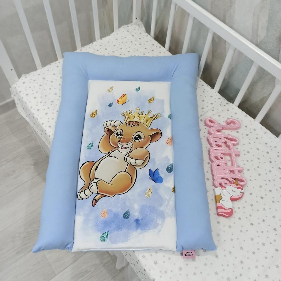 Changing mat with blue and white lion king print