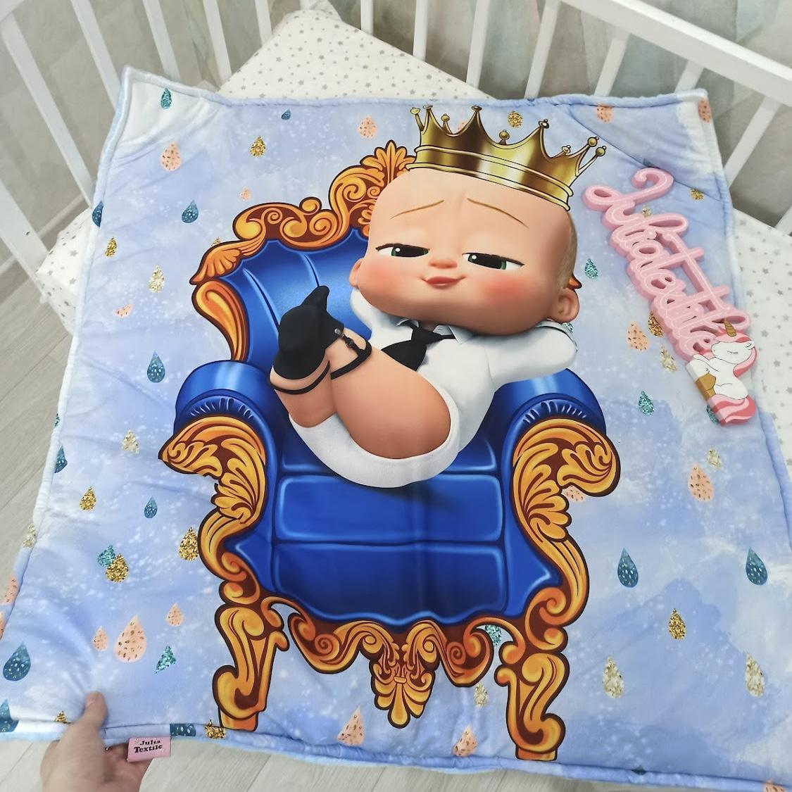 Reversible blanket with baby boss print