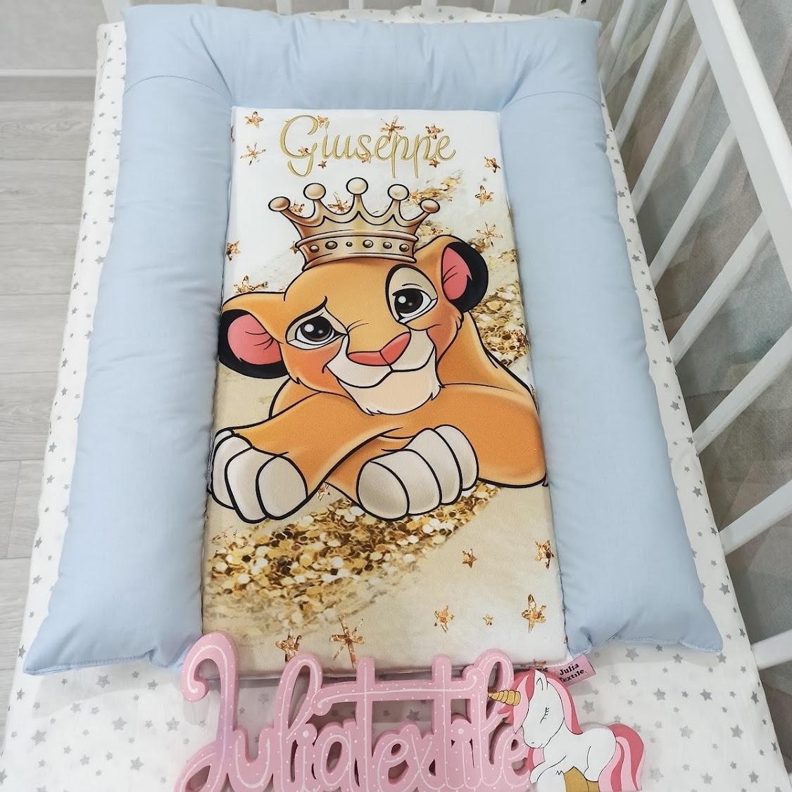 Changing table with the light blue Lion King Simba print